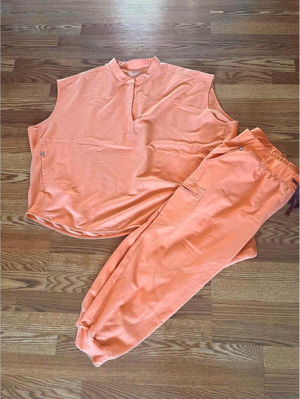Women’s FIGS scrub tank top and jogger bottom.